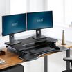 VariDesk® Pro Plus™ 36 Black sit-stand desk converter in lowered position in office