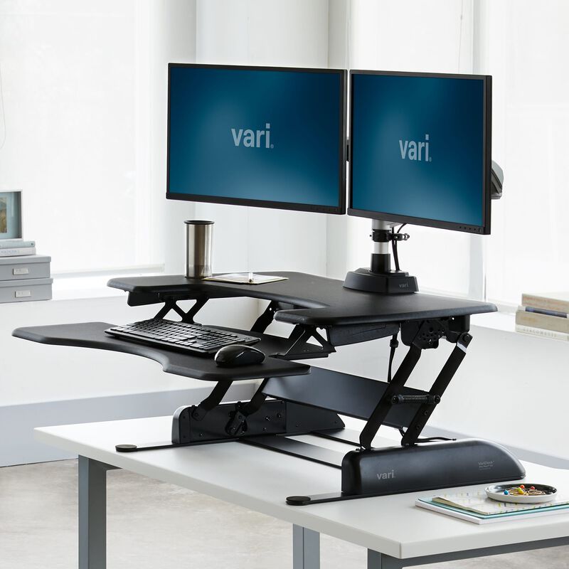 VariDesk® Pro Plus™ 36 Black sit-stand desk converter in raised position in office image number null