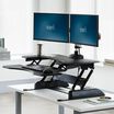 VariDesk® Pro Plus™ 36 Black sit-stand desk converter in raised position in office