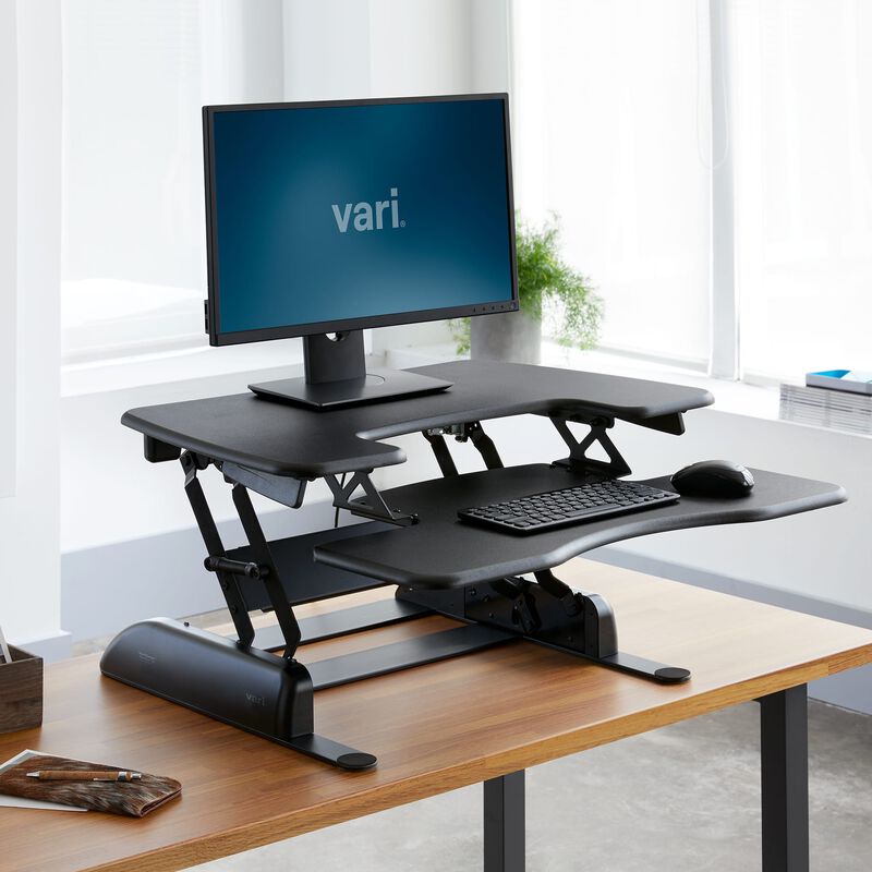 VariDesk® Pro Plus™ 30 Black in raised position at office image number null