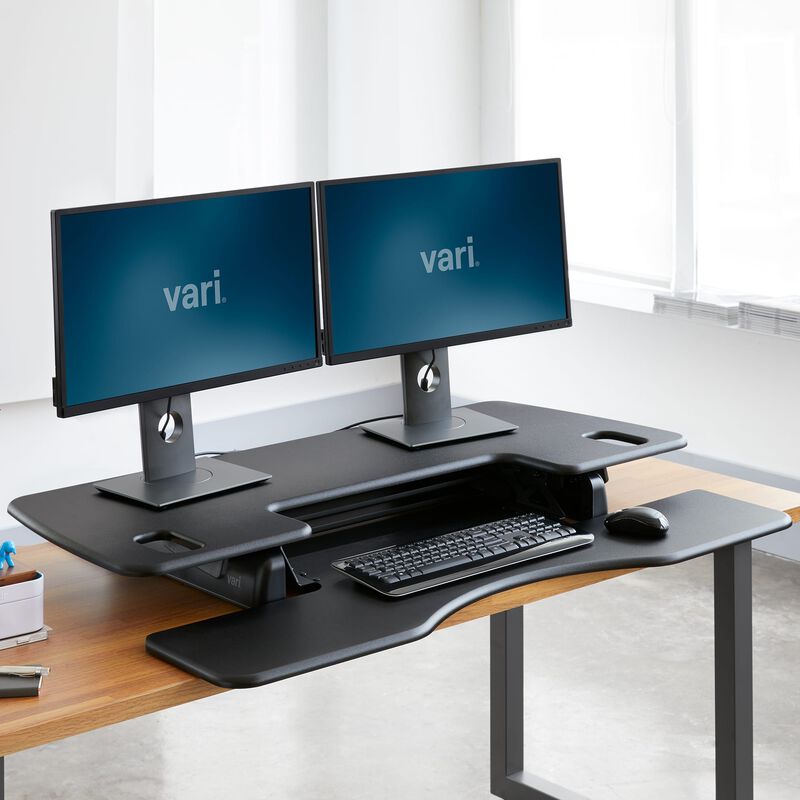 VariDesk® Pro Plus™ 48 Black in lowered position at office image number null