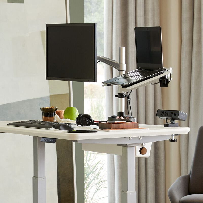 monitor arm plus laptop stand mounted on desk in home setting image number null