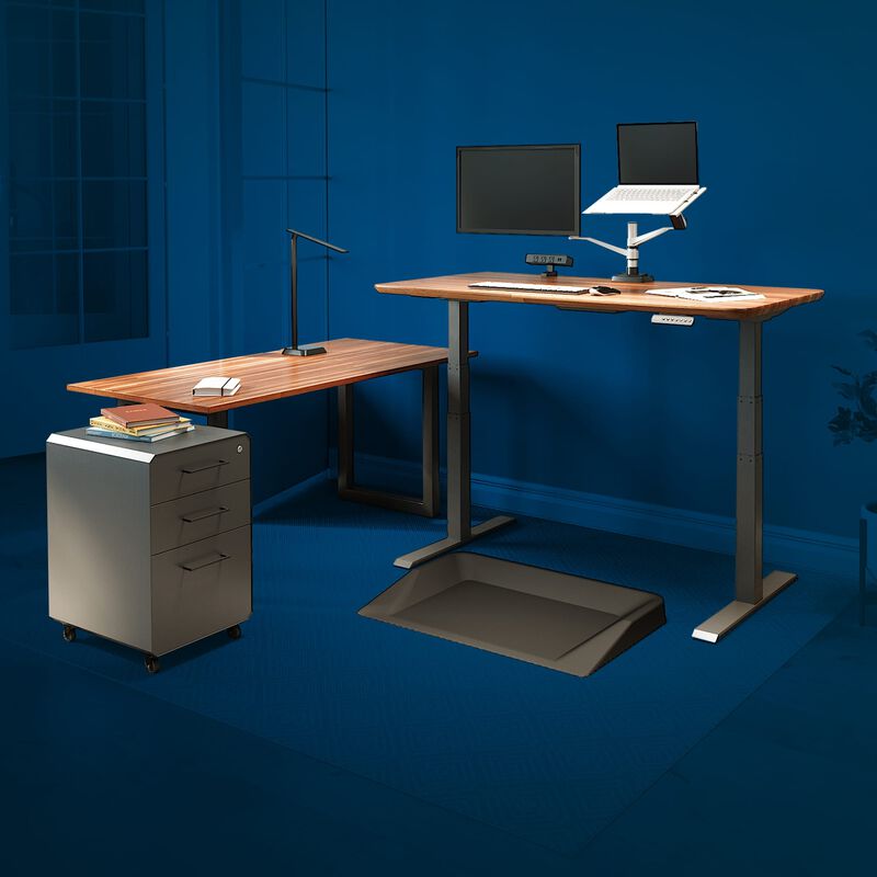 vari electric standing desk, table, and accessories in home office with blue background to highlight vari products image number null