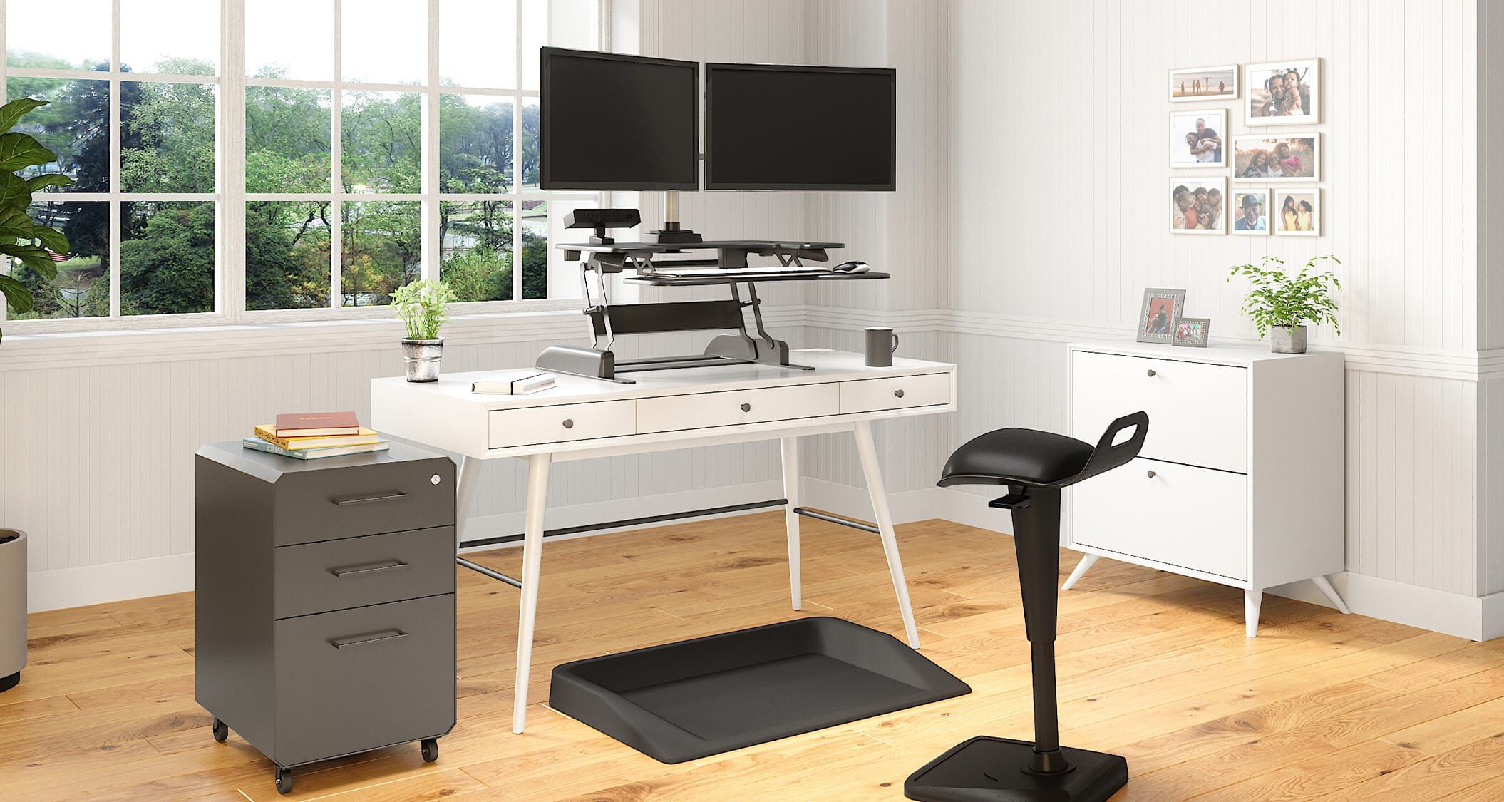 Converter placed on existing desk to create sit-stand home office